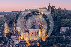 2nd and 3rd levels of Rocamadour holy village with illumination at summer twilight.Â Lot, Occitania, Southwestern France